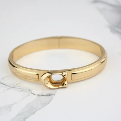 Coach Signature Sculpted C Gold Bangle