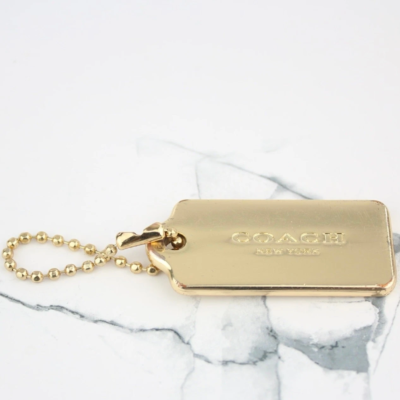 Coach Gold-Tone Metal Hangtag Charm